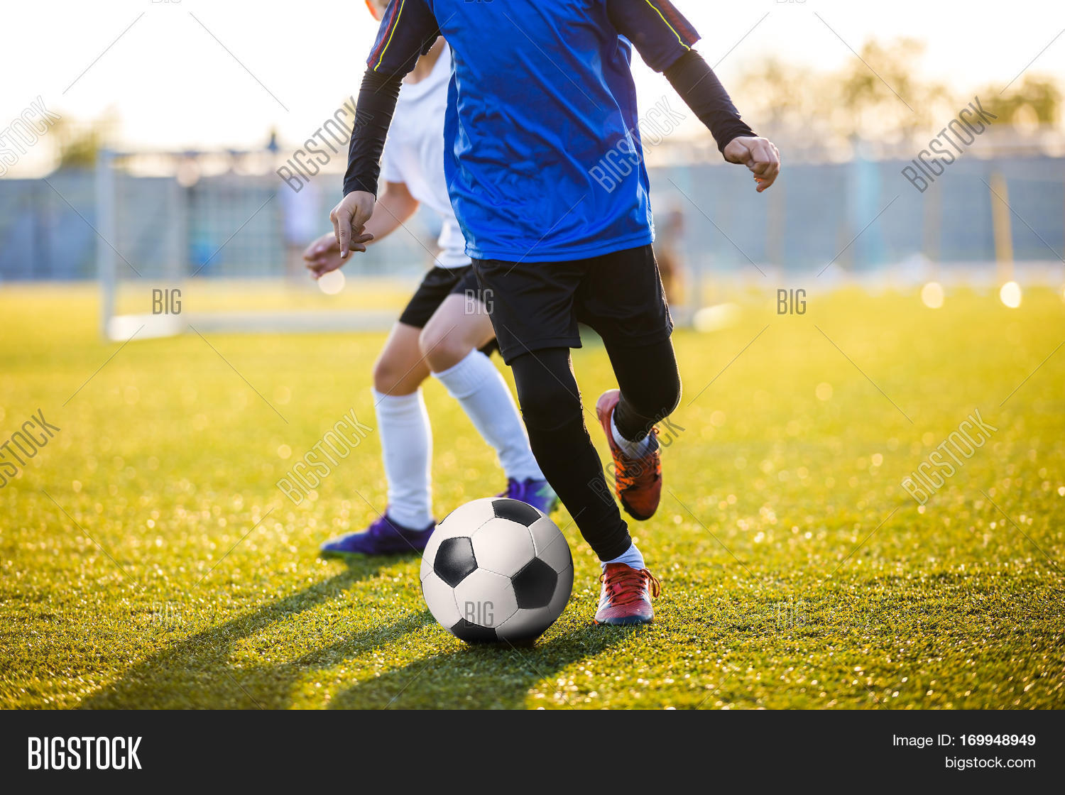 Soccer Football Players Running with Ball. Footballers Kicking Football