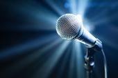 stock photo of stage  - microphone on stage with blue background - JPG 