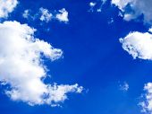 foto of blue sky  - blue sky with fluffy clouds taken on sunny day - JPG 