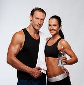 foto of fitness  - Athletic man and woman after fitness exercise - JPG 
