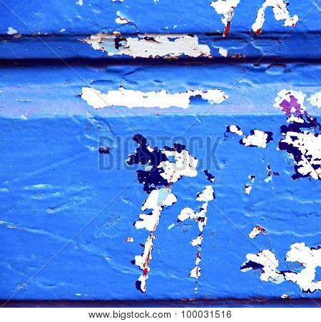 Stripped Paint In The Blue Wood Door And Rusty Nail