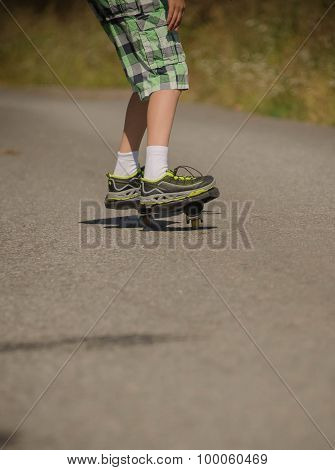 Legs in sneakers on a waveborde
