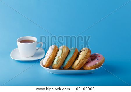 Five Donuts On Blue Background