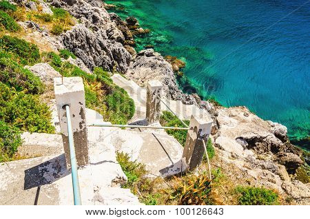 Green bushes and stairs to the beach, Greece