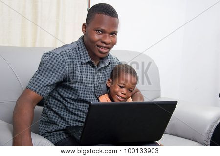 happy family in front of a laptop.