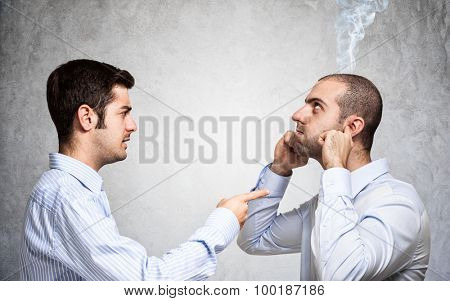 Businessman scolding a colleague
