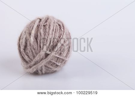 Persian cat raw wool yarn coiled into a ball
