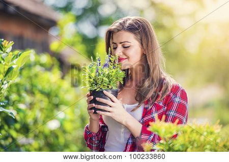 Beautiful young woman gardening