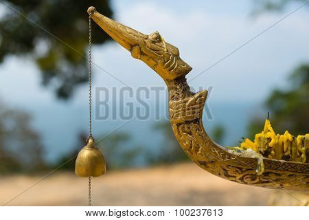 Buddhist bell on the candlestick