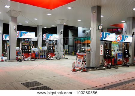 HONG KONG - APRIL 15, 2015: Caltex fuel station at evening. Caltex is a petroleum brand name of Chevron Corporation used in more than 60 countries