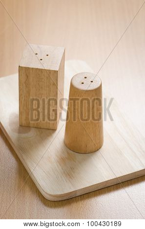 Pepperbox  And Salt Cellar On Wooden
