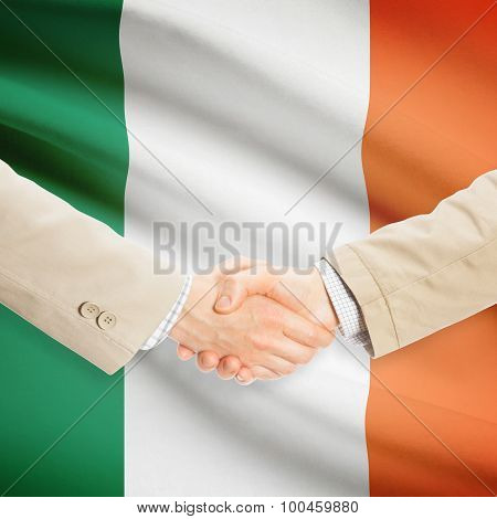 Businessmen Handshake With Flag On Background - Ireland