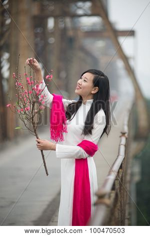 Vietnamese girl on Long Bien bridge in Hanoi, Vietnam