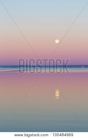 Moon Setting Over Sea.