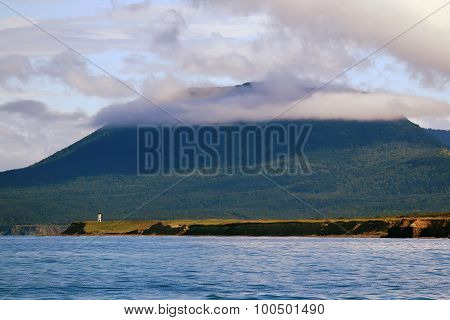 mountain in the clouds on the coast