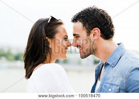 Young Beautiful Couple Rubbing Noses As A Sign Of Love