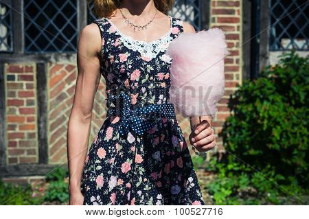 Young Woman With Candyfloss Outside