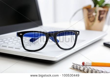 Workspace With Hipster Glasses On Laptop