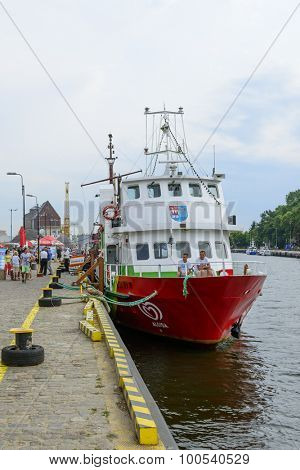 KOLOBRZEG - AUGUST 12: Tourist ship waiting in the harbor for tourists taking part in a cruise on the Baltic Sea on 12 August 2015 in Kolobrzeg, Poland. 