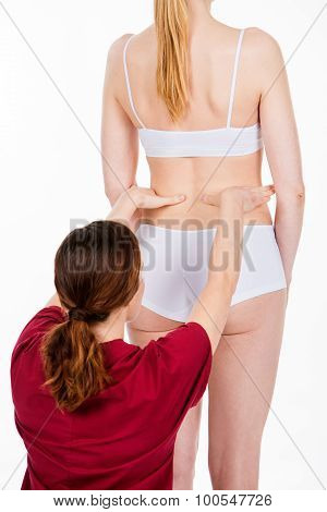 Physiotherapist Doing Back Evaluation