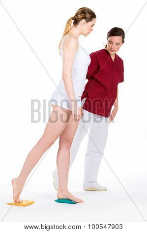 Physiotherapist With Woman Patient