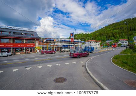 VALDRES, NORWAY - 6 JULY, 2015: Charming town of Fagernes with small city buildings sorrounded by gr
