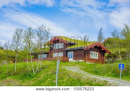 VALDRES, NORWAY - 6 JULY, 2015: Traditional norwegian mountain cabins of wood with grassy rooftops l