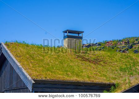 VALDRES, NORWAY - 6 JULY, 2015: Traditional Norwegian mountain cabins of wood with grassy rooftops s