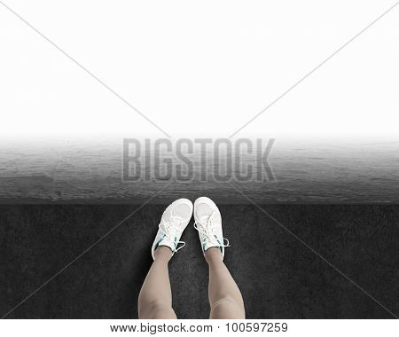 Woman standing on the edge of the roof