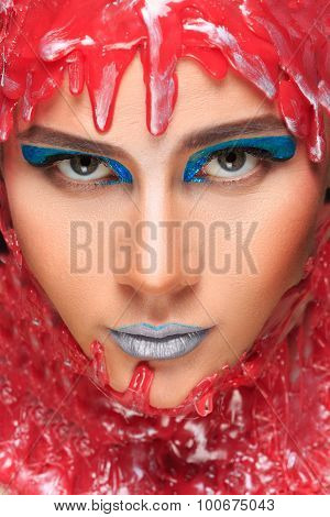 portrait of a beautiful girl bathed in red wax