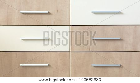 Cropped cabinet with six symmetric drawers