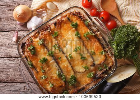 Moussaka Closeup In Baking Dish And Ingredients. Horizontal Top View
