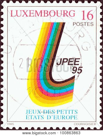 LUXEMBOURG - CIRCA 1995: Stamp shows Emblem of 6th Small European States Games, Luxembourg