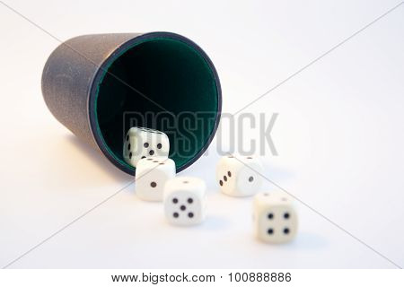 a photo of a dice cup on white background