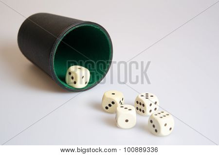 a photo of a dice cup on white background