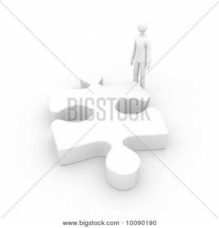 Homme face à une pièce du grand puzzle