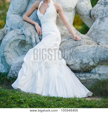 Bride, row of bridesmaids with bouquets at big wedding ceremony.