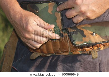 Laying of ammunition in a bandolier.