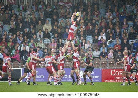 TWICKENHAM, ENGLAND. 17 SEPTEMBER 2011.  Gloucester's Brett Deacon, catches the ball during a heavy rain shower, at a lineout during the premiership rugby union match between Harlequins and Gloucester