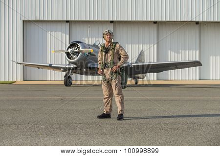 A WWII military pilot with his SNJ5 aircraft returning from a mission