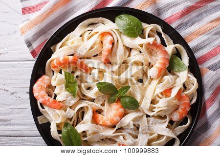 Fettuccini Pasta In Cream Sauce With Shrimp Close-up. Horizontal Top View