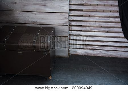 Leather Old Chest Standing On The Floor Against