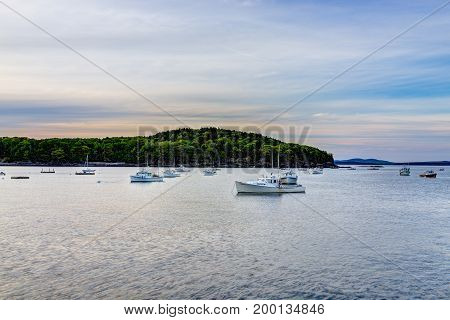 Bar Harbor USA - June 8 2017: Sunset in Bar Harbor Maine village with empty boats in water