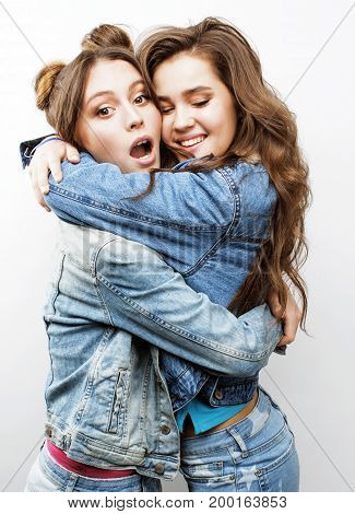 best friends teenage girls together having fun, posing emotional on white background, besties happy smiling, lifestyle real people concept close up. making selfie