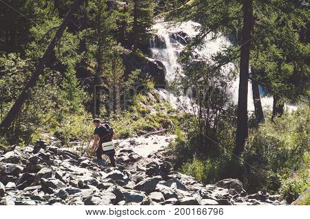 A Beautiful Waterfall In The Forest.