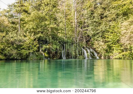 landscape with waterfall of plitvicka lake national park at sunset unesco heritage site plitvice croatia.