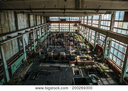 Large old workshop in an abandoned factory, abandoned industrial concept, toned