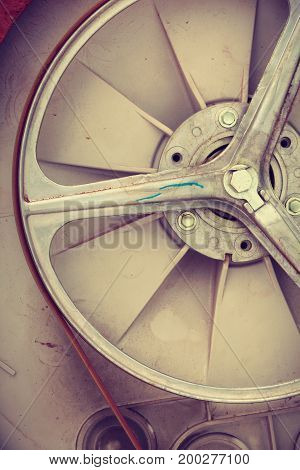 Electrical mechanical engineering household concept. Washing machine drum shown. Washer inside parts with belt.