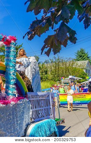 Provincetown, Massachusetts US - August 17, 2017 People walking in the 39th Annual Provincetown Carnival Gods and Goddess Parade on Commercial Street