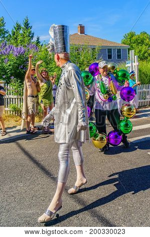 Provincetown Massachusetts US August 17 2017 People walking in the 39th Annual Provincetown Carnival Gods and Goddess Parade on Commercial Street